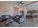 Open-concept living room and kitchen featuring hardwood floors and modern furnishings at 105 Cerise Ct, Daytona Beach, FL 32124