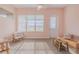 Sunroom with plenty of natural light, comfortable seating, and outdoor views at 105 Cerise Ct, Daytona Beach, FL 32124