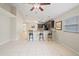 Kitchen with breakfast bar, granite counters, dark cabinets at 10727 Brown Trout Cir, Orlando, FL 32825