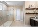 Modern bathroom featuring a glass shower with rainfall showerhead and double vanity with granite counters at 108 Blanco Dr, Deland, FL 32724