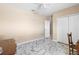 Bedroom featuring tiled floors, closet, and ceiling fan at 108 Blanco Dr, Deland, FL 32724