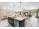 Spacious kitchen island with granite countertop and dark wood cabinets in an open concept living area at 108 Blanco Dr, Deland, FL 32724