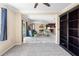 Open concept living space with a dining area, living room, and kitchen visible from bedroom with a large bookshelf at 108 Blanco Dr, Deland, FL 32724