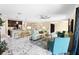 Bright and airy open-concept living space with marble tile, comfortable seating, and a kitchen island at 108 Blanco Dr, Deland, FL 32724
