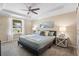 Spacious bedroom with a king-size bed and backyard view at 108 Blanco Dr, Deland, FL 32724
