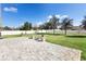 Outdoor patio featuring a stone fire pit, stone pavement, and fenced-in yard at 108 Blanco Dr, Deland, FL 32724