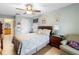 Bedroom with a double bed, ensuite bathroom access, and adjacent sitting area at 1081 Treadway Dr, Deltona, FL 32738