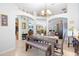 Spacious dining area with a table, bench seating, and chandelier at 1081 Treadway Dr, Deltona, FL 32738