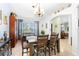 Dining room features a wooden table with chairs and a chandelier at 1081 Treadway Dr, Deltona, FL 32738