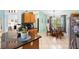 Kitchen boasts granite island, breakfast nook, and wood cabinets at 1081 Treadway Dr, Deltona, FL 32738