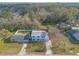 Aerial view of the home with fenced yard and surrounding landscape at 1195 10Th St, Daytona Beach, FL 32117