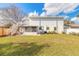 Expansive backyard featuring a screened-in porch and second story deck at 1195 10Th St, Daytona Beach, FL 32117