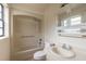 Well-lit bathroom with shower/tub combo and vanity at 1195 10Th St, Daytona Beach, FL 32117