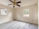 Bedroom featuring gray floors, natural light, and a ceiling fan at 1195 10Th St, Daytona Beach, FL 32117