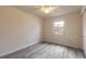 Bright bedroom featuring gray floors, and a window at 1195 10Th St, Daytona Beach, FL 32117
