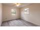 Bright bedroom with windows, gray floors, and ample natural light at 1195 10Th St, Daytona Beach, FL 32117