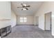 Living room with vaulted ceiling, fireplace, and access to an adjacent room at 1195 10Th St, Daytona Beach, FL 32117