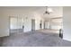 Open concept living room featuring kitchen, and mirrored closet at 1195 10Th St, Daytona Beach, FL 32117