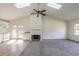 Living room with fireplace, vaulted ceilings, skylights and access to back deck at 1195 10Th St, Daytona Beach, FL 32117