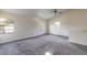 Living room with vaulted ceilings, multiple windows, and neutral carpet at 1195 10Th St, Daytona Beach, FL 32117