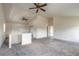 Spacious living room with vaulted ceilings, ceiling fans, and neutral carpet at 1195 10Th St, Daytona Beach, FL 32117