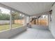 Spacious screened patio with a view to the fenced yard at 1195 10Th St, Daytona Beach, FL 32117