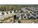 Aerial view of homes and community featuring mature trees and landscaping at 1310 Eggleston Dr, Deland, FL 32724