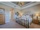 Spacious Primary bedroom with ornate bed frame and ensuite bathroom access at 1310 Eggleston Dr, Deland, FL 32724