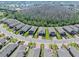 Aerial view of the neighborhood showcasing well-maintained homes in an organized community setting at 1372 Lombardi Ct, Poinciana, FL 34759