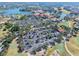 Aerial view of the community with lush landscaping, golf course, and lakes at 1372 Lombardi Ct, Poinciana, FL 34759