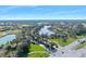Beautiful aerial view featuring a neighborhood with lakes, green spaces, and roadways at 1372 Lombardi Ct, Poinciana, FL 34759