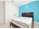 Comfortable bedroom features a closet, and a blue accent wall at 1372 Lombardi Ct, Poinciana, FL 34759