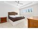 Bright bedroom featuring tile floors, a ceiling fan, and shuttered windows at 1372 Lombardi Ct, Poinciana, FL 34759