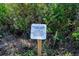 Vegetative natural buffer area sign denoting no dumping and disturbance to native soils allowed beyond this point at 1372 Lombardi Ct, Poinciana, FL 34759