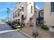Commercial building featuring stucco exterior, decorative street lamps and golf cart parking at 1372 Lombardi Ct, Poinciana, FL 34759