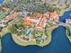 Aerial view of resort style neighborhood with amenities including a pool, lakes, and clubhouse at 1372 Lombardi Ct, Poinciana, FL 34759