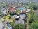Aerial of Community center with pools, tennis courts, lush landscaping, and parking at 1372 Lombardi Ct, Poinciana, FL 34759