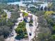 Elegant gated community entrance with lush landscaping and manicured gardens at 1372 Lombardi Ct, Poinciana, FL 34759