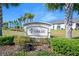 Arese community sign with palm trees and green landscaping at 1372 Lombardi Ct, Poinciana, FL 34759