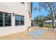 Restaurant exterior featuring green window frames and an outdoor dining area surrounded by palm trees at 1372 Lombardi Ct, Poinciana, FL 34759