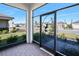 View from screened front porch; showcases landscaping in the neighborhood at 1372 Lombardi Ct, Poinciana, FL 34759