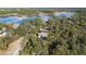Gorgeous aerial view of home featuring a lake view with lush landscaping and serene surroundings at 149 Sheryl Dr, Deltona, FL 32738
