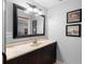 Bathroom featuring a spacious vanity with framed mirror, ample lighting, and tasteful decor enhancing its appeal at 149 Sheryl Dr, Deltona, FL 32738