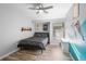Spare bedroom featuring a twin bed, wood flooring, and decorated wall at 149 Sheryl Dr, Deltona, FL 32738