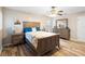Comfortable bedroom with wood flooring, ceiling fan, and matching furniture set at 149 Sheryl Dr, Deltona, FL 32738