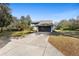 Two-story home featuring a blue exterior, an attached two car garage, and a concrete driveway at 149 Sheryl Dr, Deltona, FL 32738