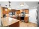 Kitchen featuring granite countertops, stainless appliances, and ample cabinetry at 149 Sheryl Dr, Deltona, FL 32738