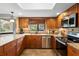 Kitchen with granite countertops, stainless appliances, and window with view at 149 Sheryl Dr, Deltona, FL 32738