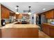 Spacious kitchen with granite countertops, stainless steel appliances, and island at 149 Sheryl Dr, Deltona, FL 32738