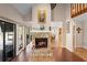 Inviting living room featuring a stone fireplace and sliding glass doors to lanai at 149 Sheryl Dr, Deltona, FL 32738